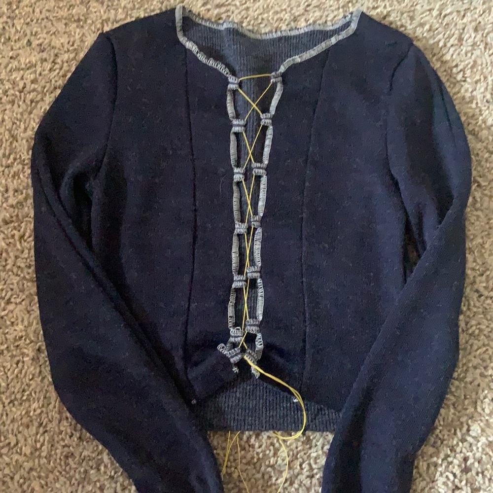Cropped sweater with lace up detail